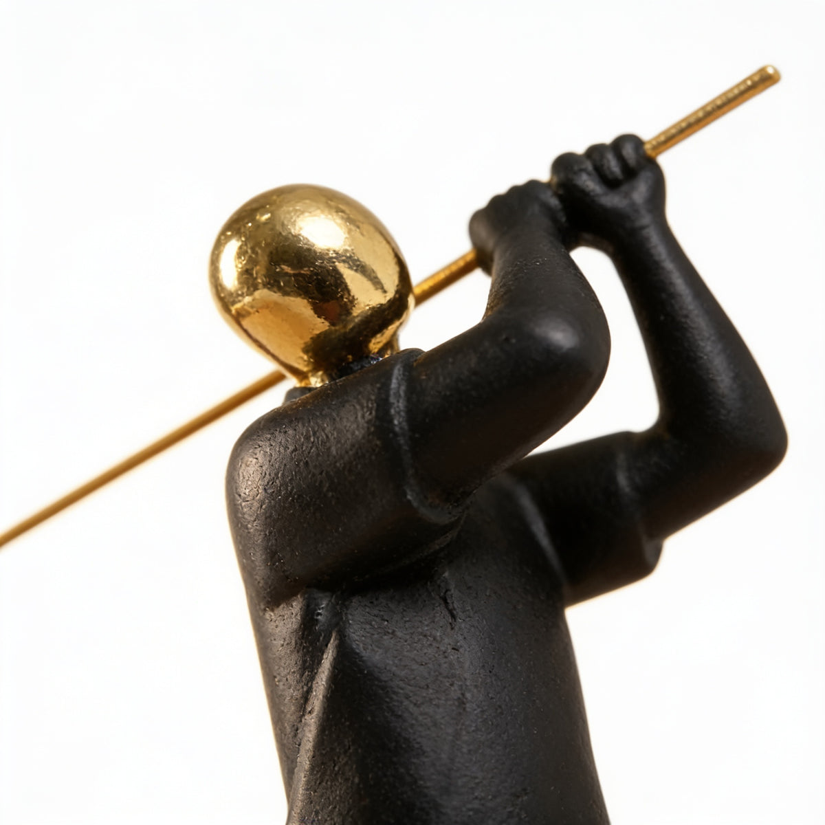 Close-up of the polished gold-tone head and matte black resin texture — Black & Gold Sports Figurine