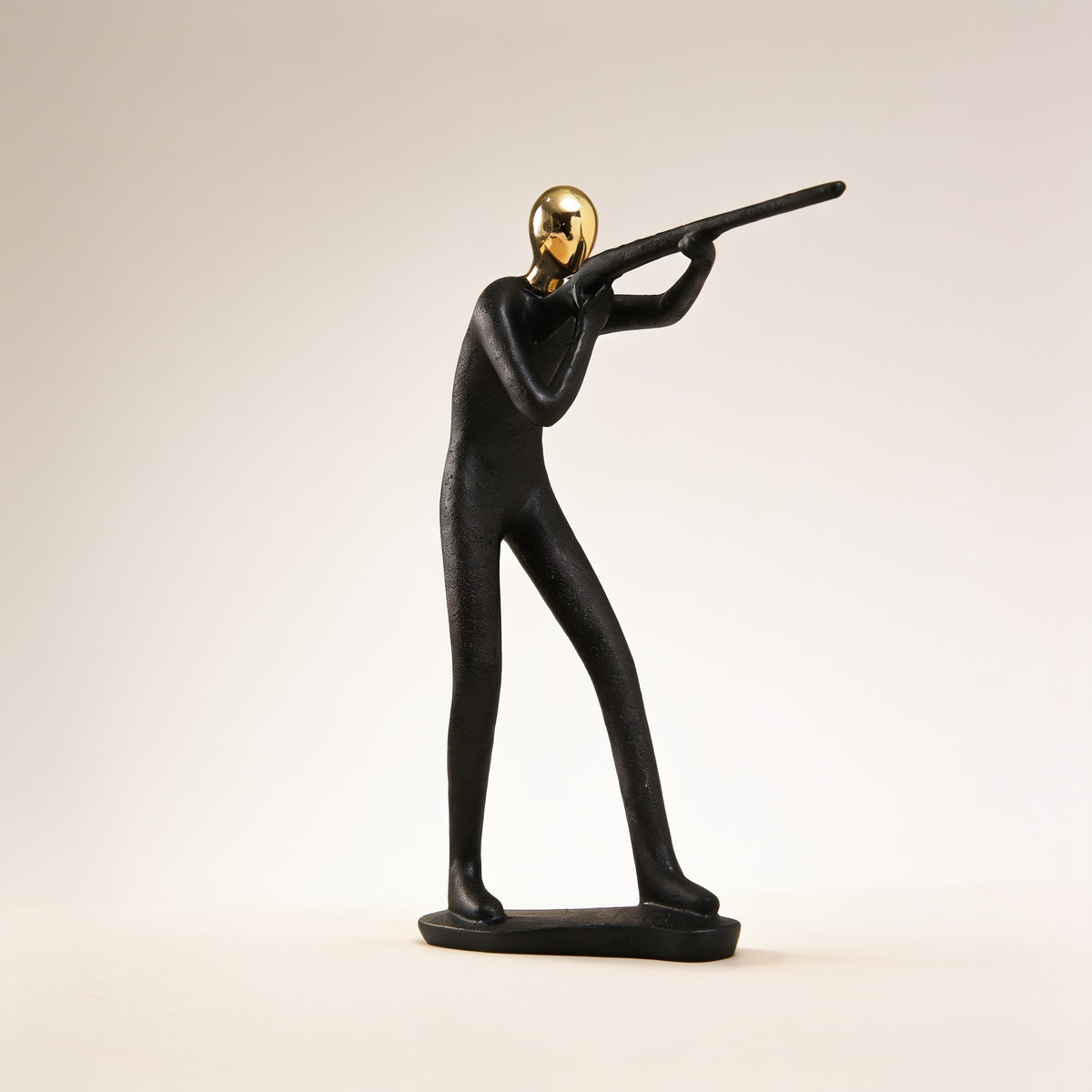 Marksman pose, black and gold resin figurine on cream background — Black & Gold Sports Figurine