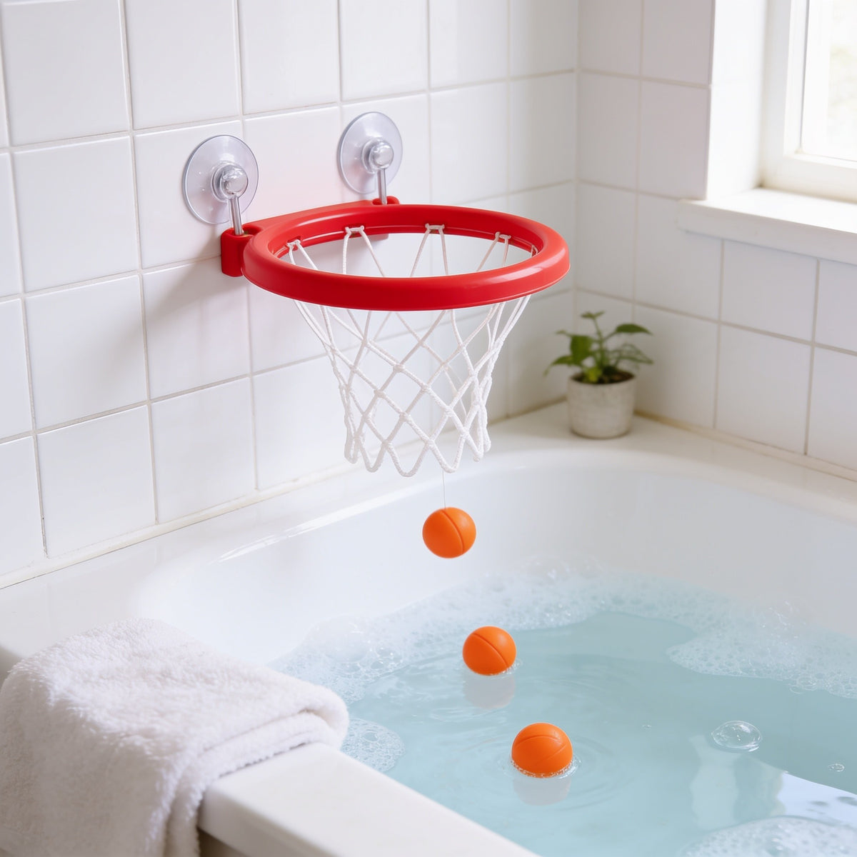 Basketball Hoop & 3 Balls toddler bath toy in a bright bathtub.