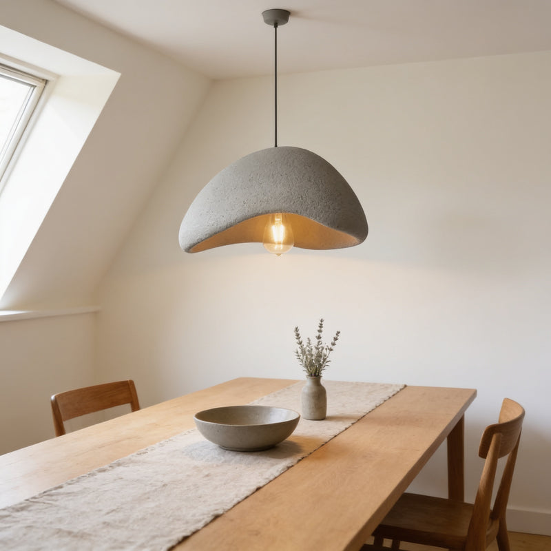 Grey wabi-sabi pebble Wave pendant light, warm white, over an oak dining table — Wabi-Sabi Pebble Dome Pendant Light