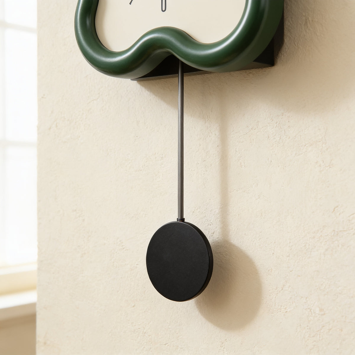 Detail of the pendulum rod and black disc below the clock — Wavy Flower-Shaped Wall Clock