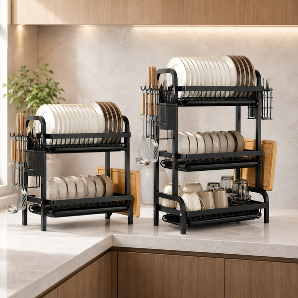Two black vertical dish racks drying plates, bowls, mugs and utensils on a stone kitchen countertop